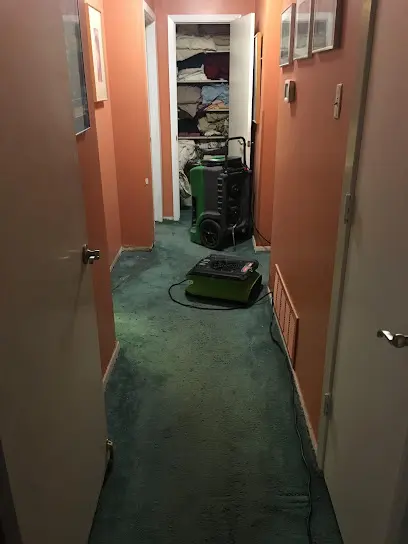 Restoration technician drying a floor in a Hawthorne, CA home